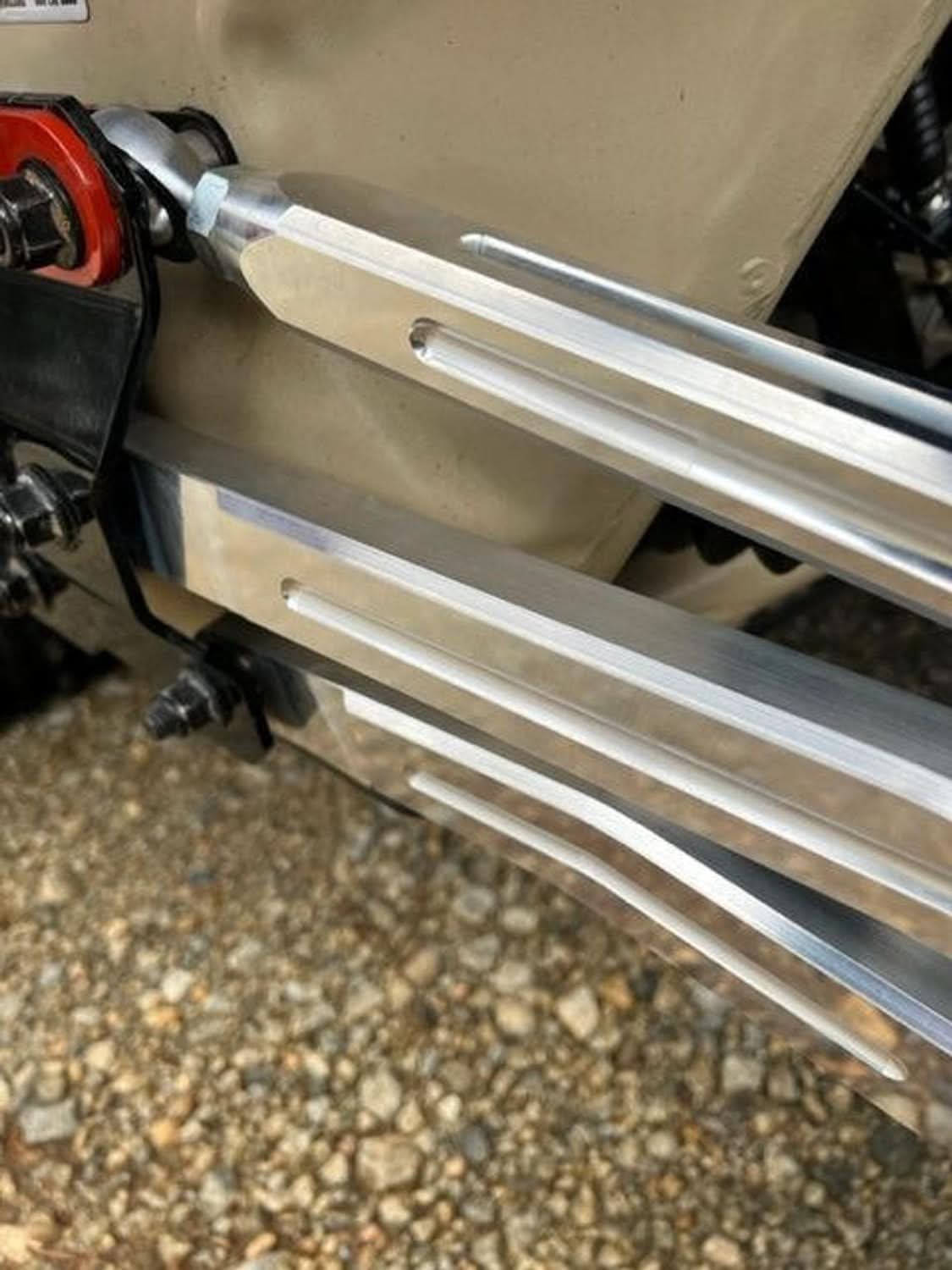 Close-up of L&W Fab adjustable radius rods installed on Can-Am Maverick X3 for enhanced performance and durability.