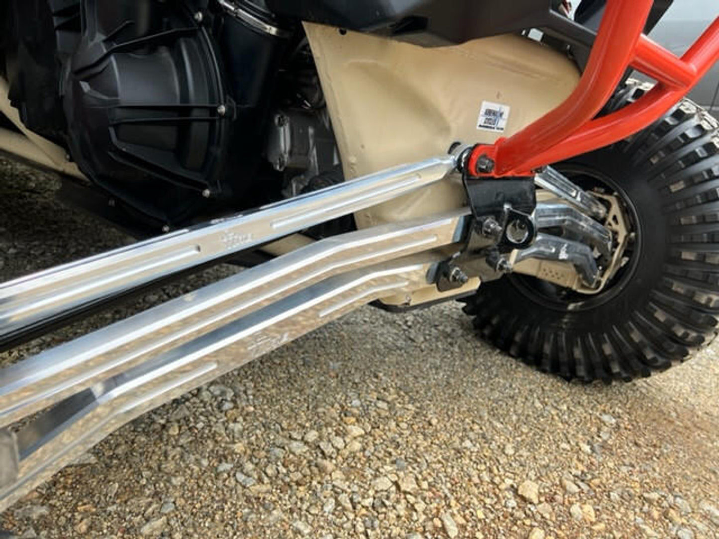 Close-up of Can-Am Maverick X3 adjustable radius rods showcasing aluminum construction and durable design.
