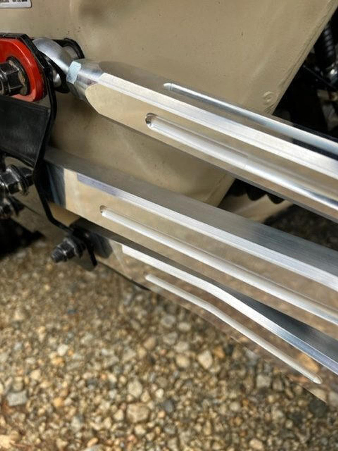 Close-up of L&W Fab adjustable radius rods installed on Can-Am Maverick X3 for enhanced performance and durability.