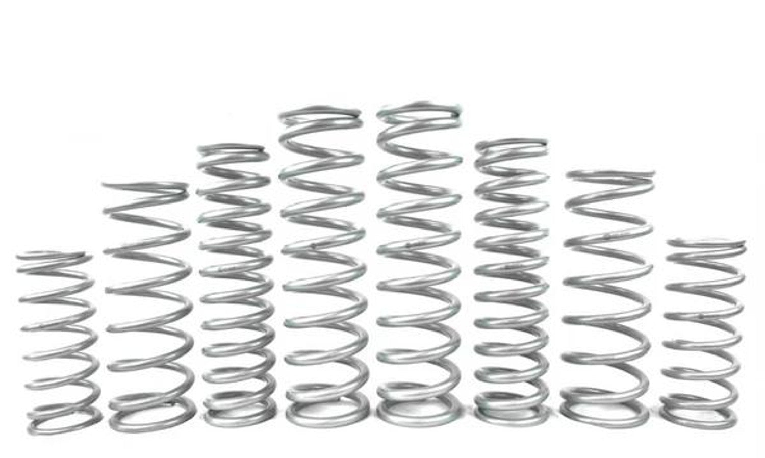 Various metal springs arranged in a row, showcasing different sizes for UTV suspension systems.